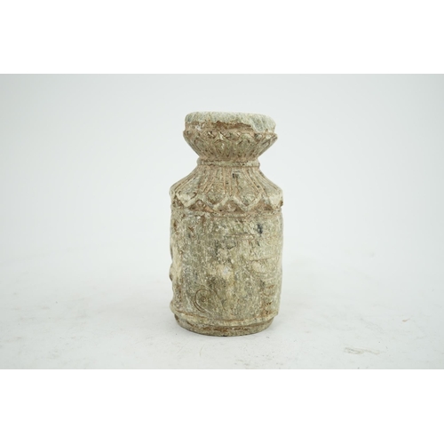 30 - A Gandharan Buddhist carved schist stem cup, carved in relief with figures and a stupa, 6.5cm diamet... 