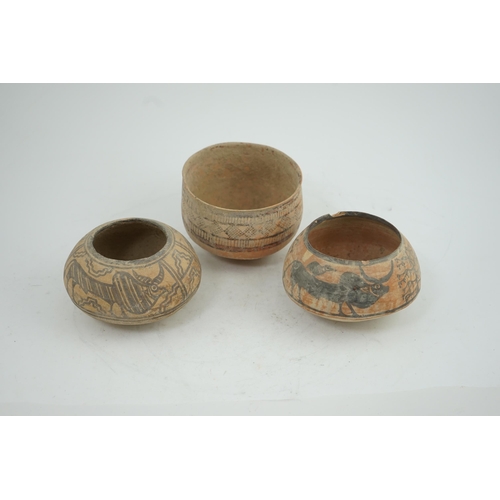 32 - Three Indus Valley pottery bowls, 3rd-2nd millennium BC, each painted in a black pigment, two with o... 