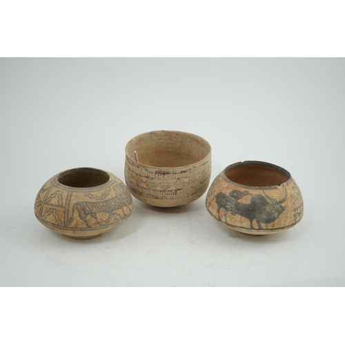 32 - Three Indus Valley pottery bowls, 3rd-2nd millennium BC, each painted in a black pigment, two with o... 