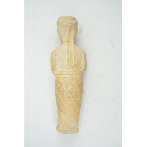 34 - An unusual limestone votive figure, with cuneiform inscription, possibly Mesopotamian, in standing p... 