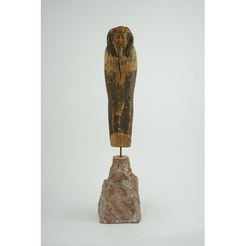 36 - An Ancient Egyptian miniature wood statuette of Ptah-Sokar-Osiris, probably late Kingdom, on a later... 