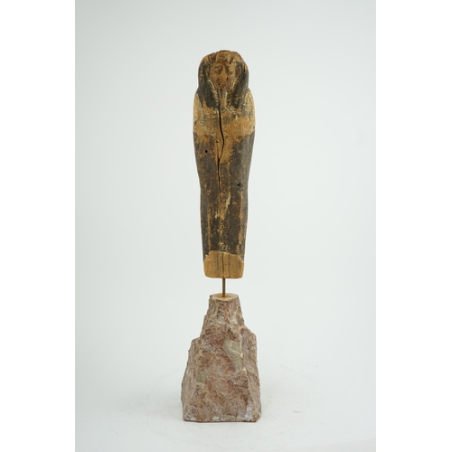 36 - An Ancient Egyptian miniature wood statuette of Ptah-Sokar-Osiris, probably late Kingdom, on a later... 