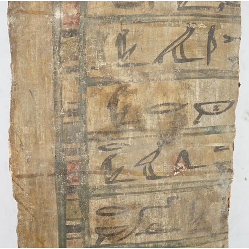 38 - An Ancient Egyptian painted gesso, linen and wood fragment from a coffin or canopic chest, probably ... 