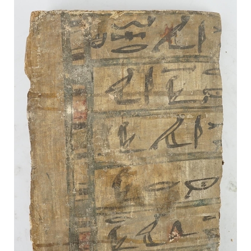 38 - An Ancient Egyptian painted gesso, linen and wood fragment from a coffin or canopic chest, probably ... 