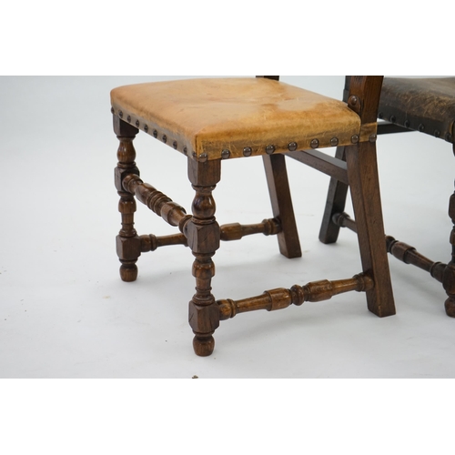 4 - A set of fourteen 17th century style oak dining chairs including a pair of carvers, with brass studd... 