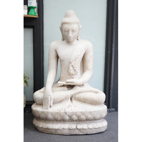 41 - A massive Burmese marble seated figure of Buddha Shakyamuni, 18th/19th century, seated on a double l... 