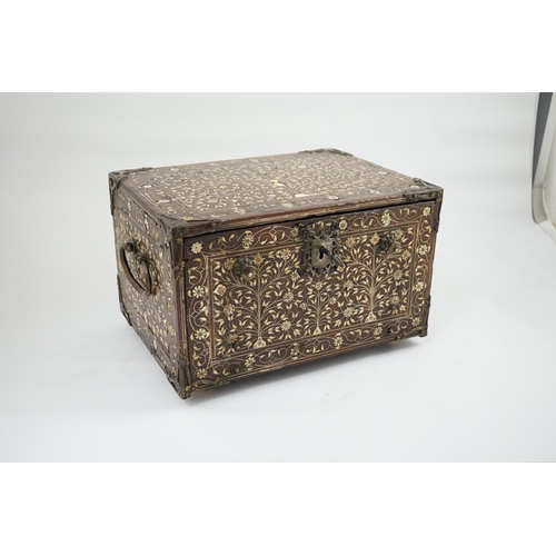 42 - An early 17th century Indo-Portuguese ivory inset hardwood travelling chest with brass loop handles,... 