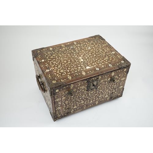 42 - An early 17th century Indo-Portuguese ivory inset hardwood travelling chest with brass loop handles,... 