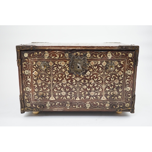 42 - An early 17th century Indo-Portuguese ivory inset hardwood travelling chest with brass loop handles,... 