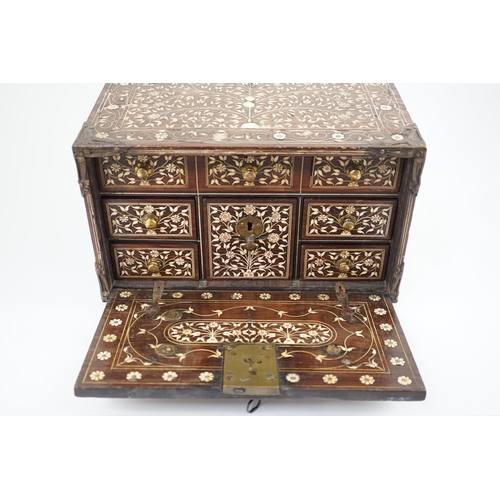 42 - An early 17th century Indo-Portuguese ivory inset hardwood travelling chest with brass loop handles,... 