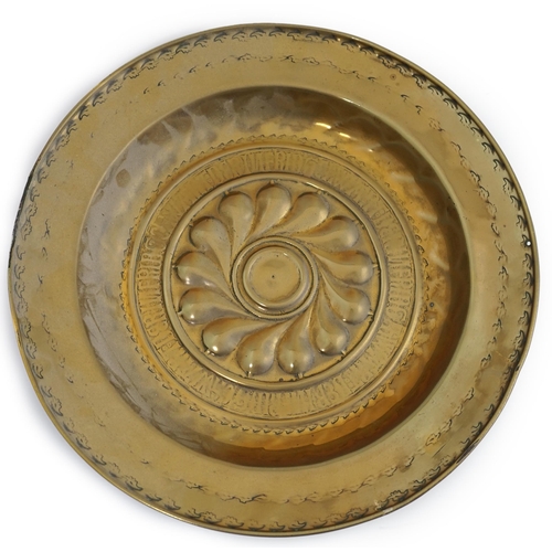 43 - A 16th century German brass alms dish, Nuremberg, circa 1550, with stylised foliate banding and rubb... 