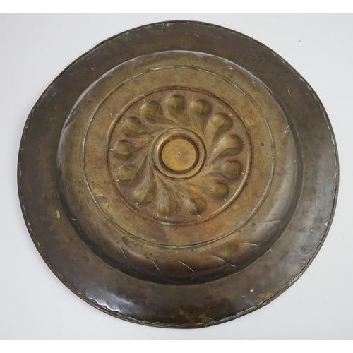 43 - A 16th century German brass alms dish, Nuremberg, circa 1550, with stylised foliate banding and rubb... 