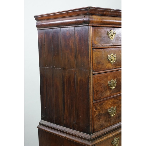 44 - An early 18th century walnut chest on stand with cushion frieze drawer over two short and three grad... 