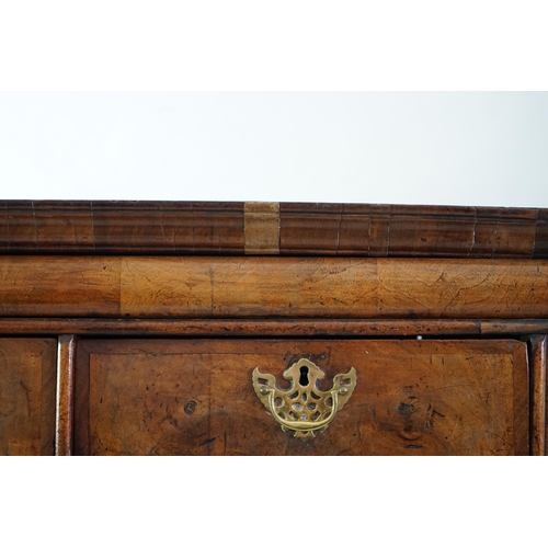 44 - An early 18th century walnut chest on stand with cushion frieze drawer over two short and three grad... 