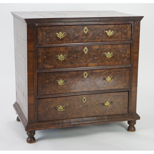 46 - A William and Mary oyster veneered laburnum and walnut chest of four long drawers, with geometric st... 