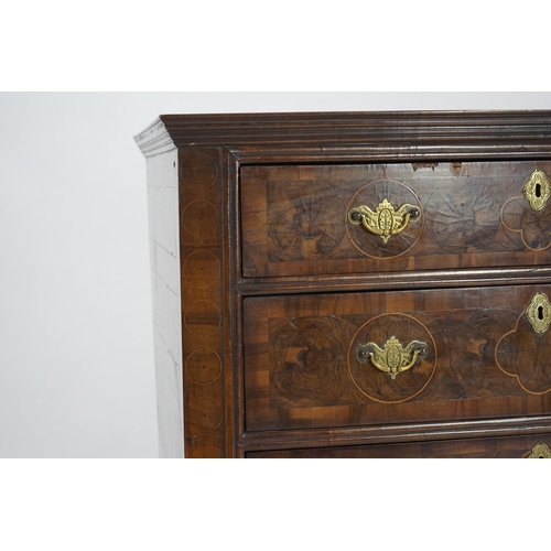 46 - A William and Mary oyster veneered laburnum and walnut chest of four long drawers, with geometric st... 