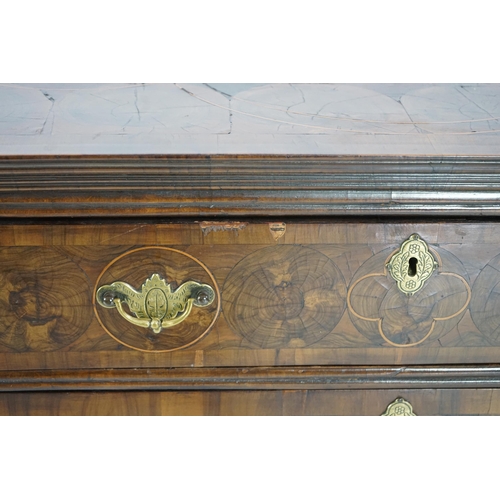 46 - A William and Mary oyster veneered laburnum and walnut chest of four long drawers, with geometric st... 