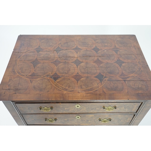 46 - A William and Mary oyster veneered laburnum and walnut chest of four long drawers, with geometric st... 