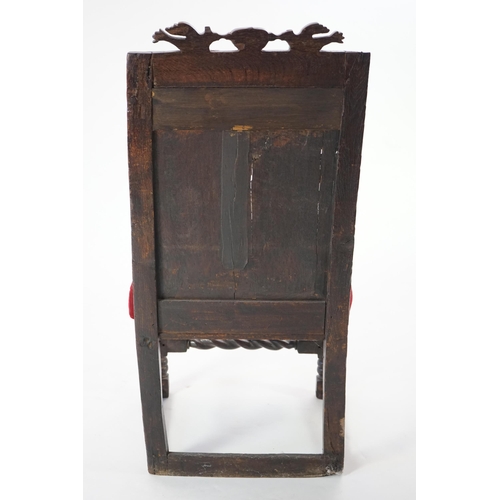 49 - A 17th century and later Yorkshire oak Wainscot elbow chair, the panelled back carved with stylised ... 