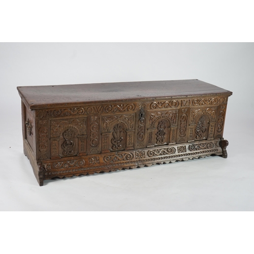 55 - A mid 18th century German carved oak marriage chest with single planked lid, the frieze, initialled ... 