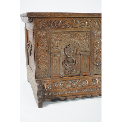 55 - A mid 18th century German carved oak marriage chest with single planked lid, the frieze, initialled ... 