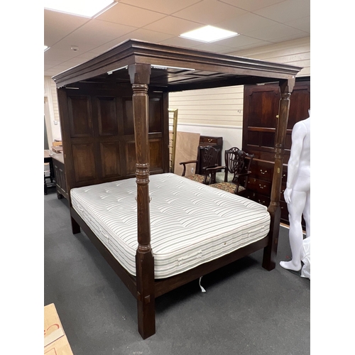 59 - A 17th century style oak full tester bedstead with moulded cornice, panelled headboard and turned fr... 