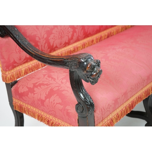 6 - A 17th century style walnut settee with upholstered back and seat, acanthus carved scroll arms with ... 