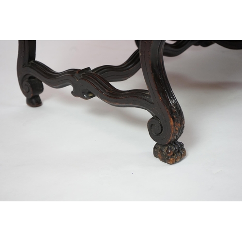 6 - A 17th century style walnut settee with upholstered back and seat, acanthus carved scroll arms with ... 