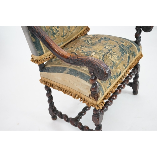 60 - A 17th century French walnut fauteuil with verdure tapestry upholstery, the back depicting a mother ... 