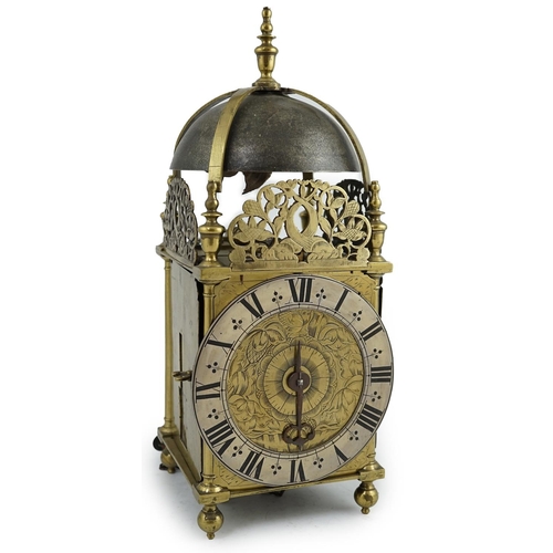 61 - A late 17th century brass lantern clock of traditional form with dolphin and flower pierced crests, ... 