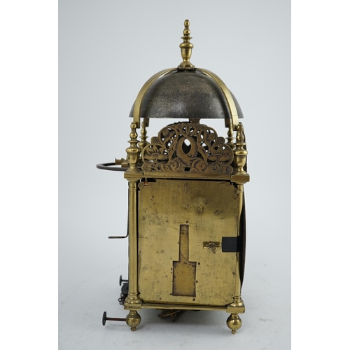 61 - A late 17th century brass lantern clock of traditional form with dolphin and flower pierced crests, ... 