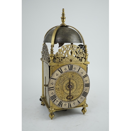 61 - A late 17th century brass lantern clock of traditional form with dolphin and flower pierced crests, ... 