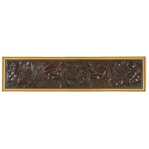 63 - A 17th century oak panel carved with a central cartouche of a reclining bearded man holding a branch... 