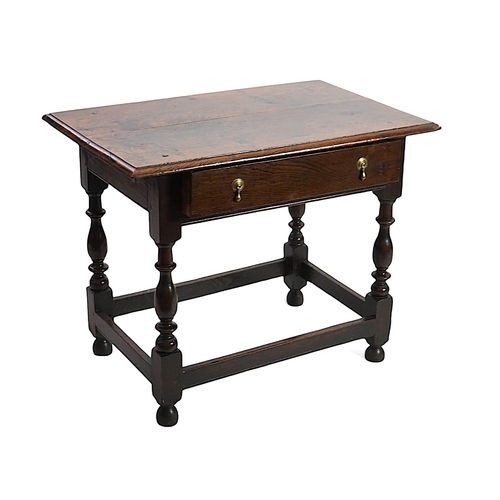 64 - An early 18th century and later oak side table with moulded rectangular top over a frieze drawer, on... 