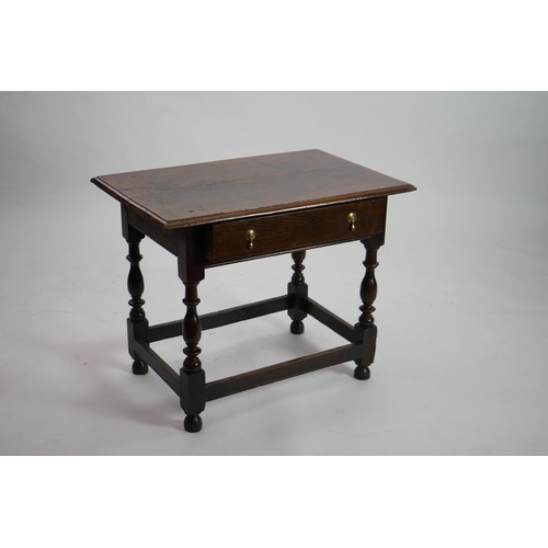 64 - An early 18th century and later oak side table with moulded rectangular top over a frieze drawer, on... 