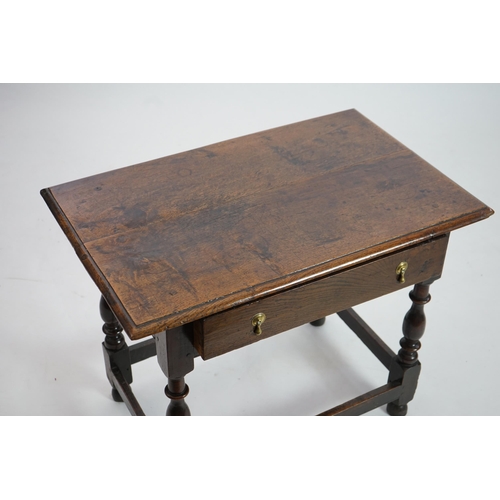 64 - An early 18th century and later oak side table with moulded rectangular top over a frieze drawer, on... 