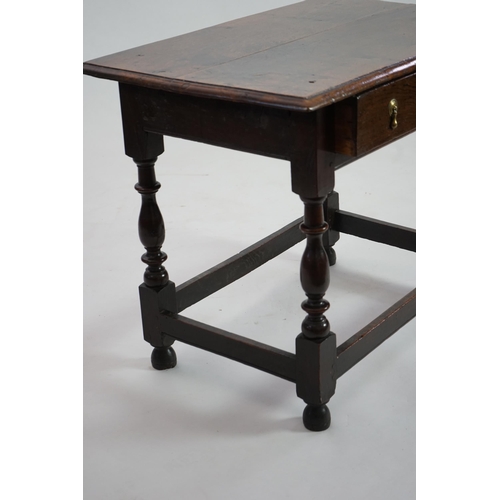 64 - An early 18th century and later oak side table with moulded rectangular top over a frieze drawer, on... 