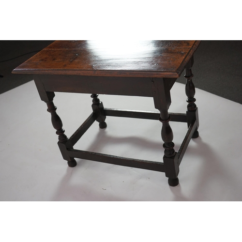 64 - An early 18th century and later oak side table with moulded rectangular top over a frieze drawer, on... 