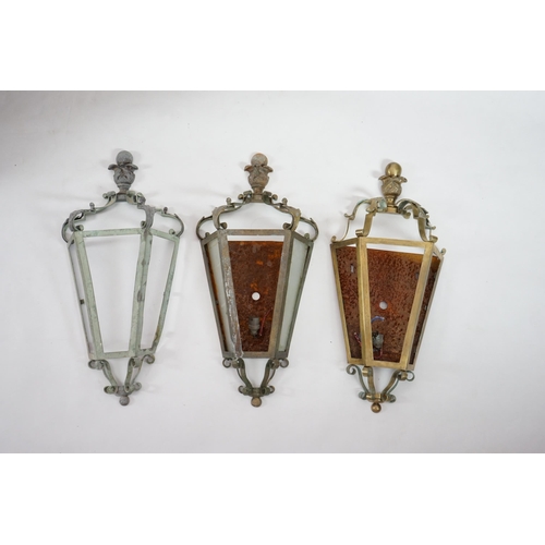 65 - A set of three antique French brass wall lights of demi-hexagonal lantern form, with foliate and bal... 