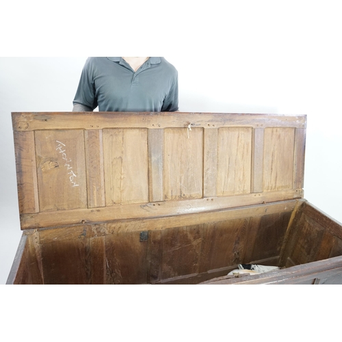 68 - A 17th century oak coffer with five panel top, on squared stile feet, 172cm wide, 57cm deep, 85cm hi... 