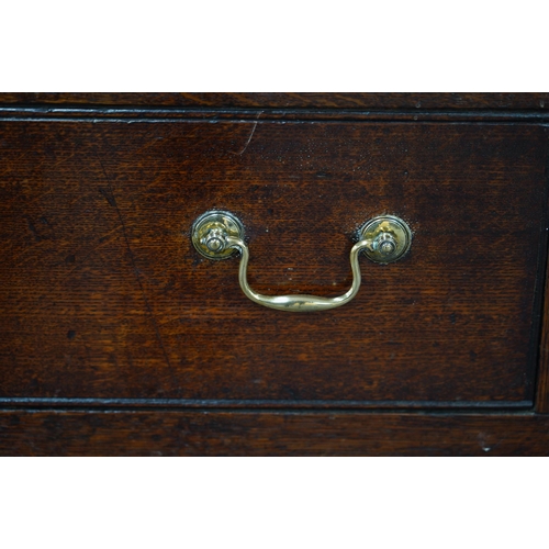 7 - A mid 18th century oak press cupboard with moulded cornice and three panelled doors over three dummy... 