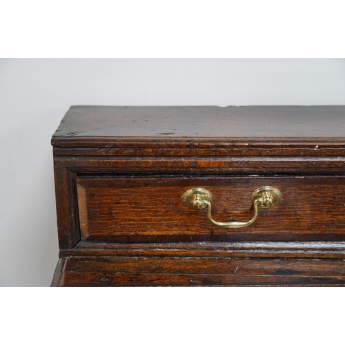 9 - A George III oak dresser base, the raised back with six crossbanded drawers over three frieze drawer... 