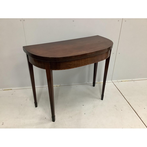 100 - A Regency ebony strung mahogany folding tea table, width 92cm, height 74cm. Condition - fair to good... 