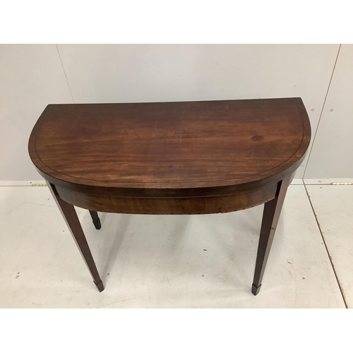 100 - A Regency ebony strung mahogany folding tea table, width 92cm, height 74cm. Condition - fair to good... 