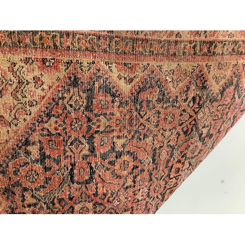 111 - A Caucasian red ground rug, 192 x 129cm. Condition - faded and worn