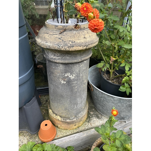 19 - Three assorted terracotta chimney pots, largest height 90cm. Condition - weathered, some small chips... 