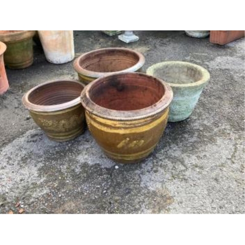 22 - A collection of assorted glazed pottery garden pots and ornaments, largest diameter 42cm. Condition ... 