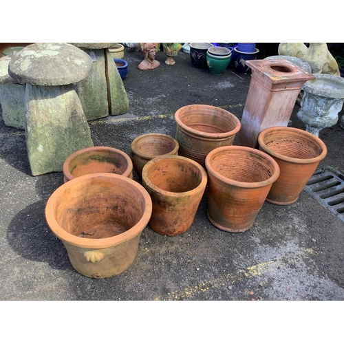 28 - Twenty assorted terracotta planters, largest height 40cm, diameter 42cm, a terracotta pedestal, heig... 