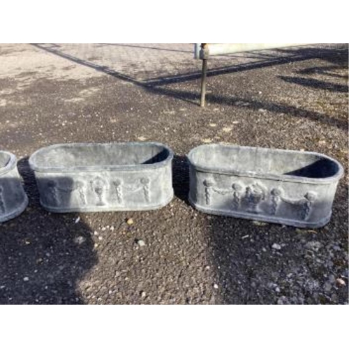 31 - A set of four cast iron planters, width 36cm, and a pair of more ornate planters, width 48cm. Condit... 