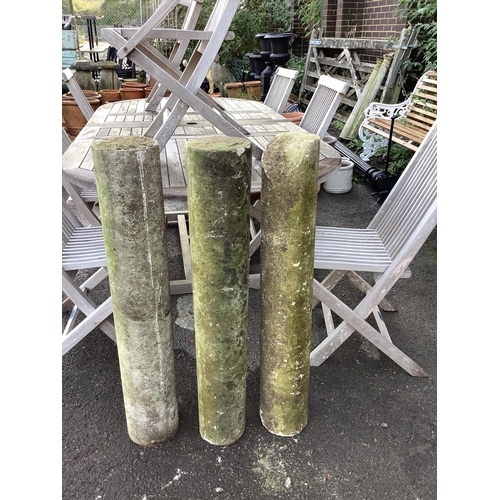 41 - A set of three plain stone columns, diameter 15cm, height 96cm. Condition - weathered condition, one... 